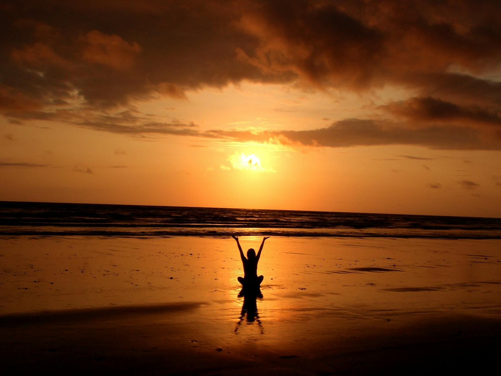 silhouette of person raising its hand